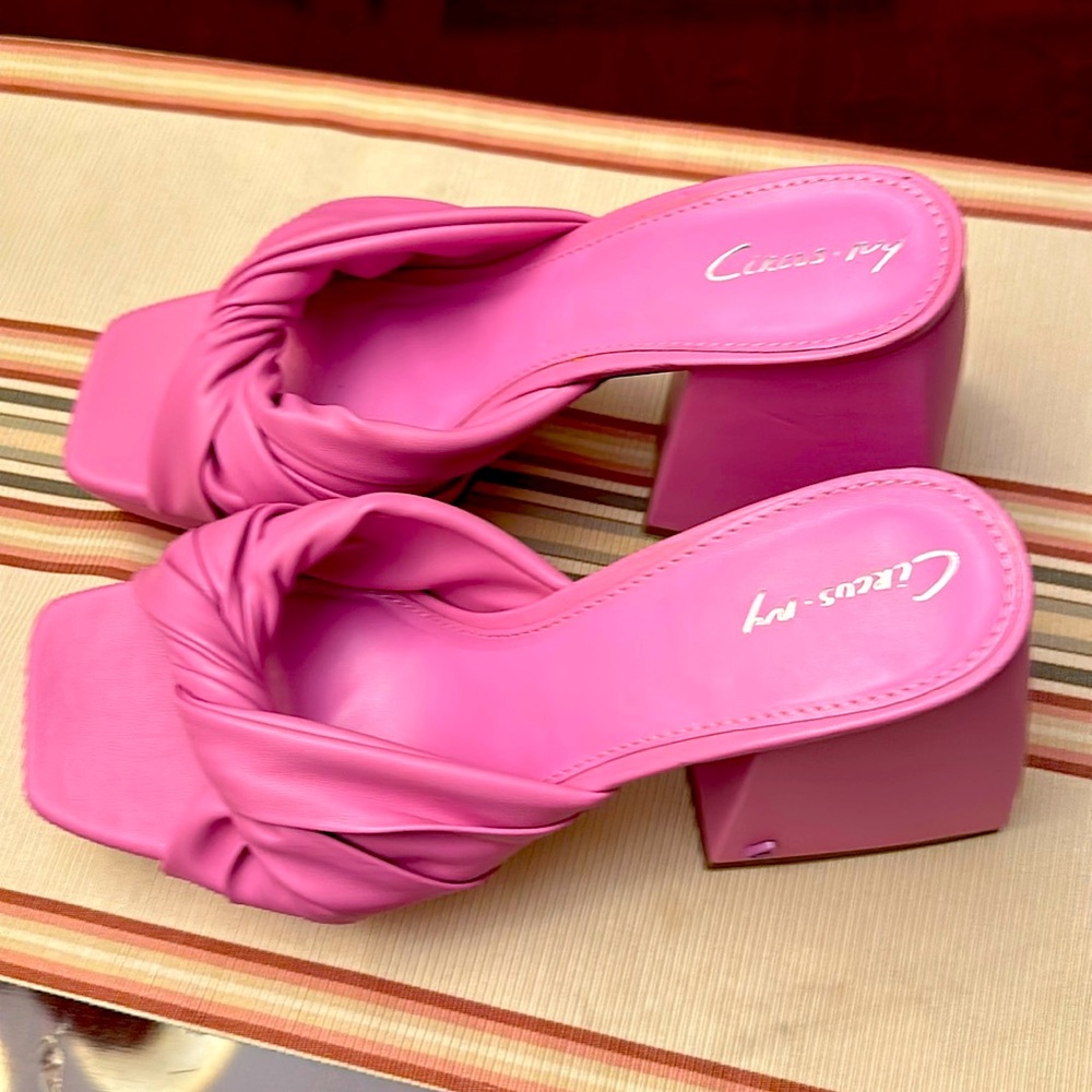 Pink mules by Circus NY.